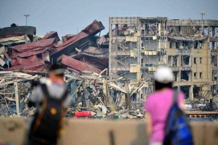 Тяньжин: 1.5 тэрбум долларын хохирол амсчээ