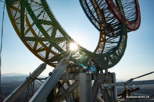 Бээжин: Цамхаг дээр Олимпын цагариг суурилуулах ажил дуусжээ